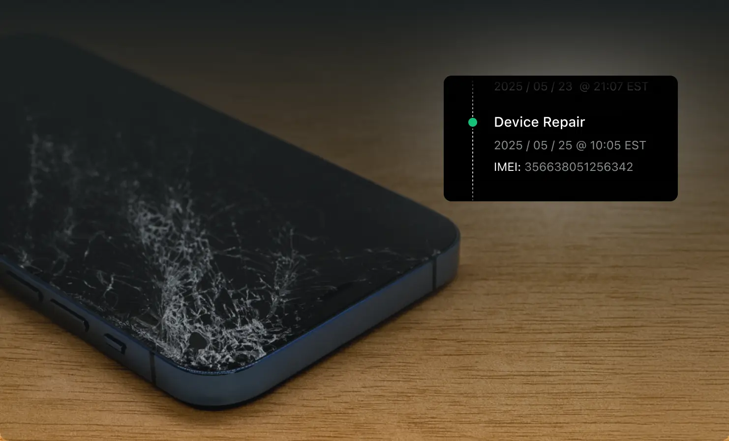 Cracked smartphone sitting on a table with a card showing repair status in the platform