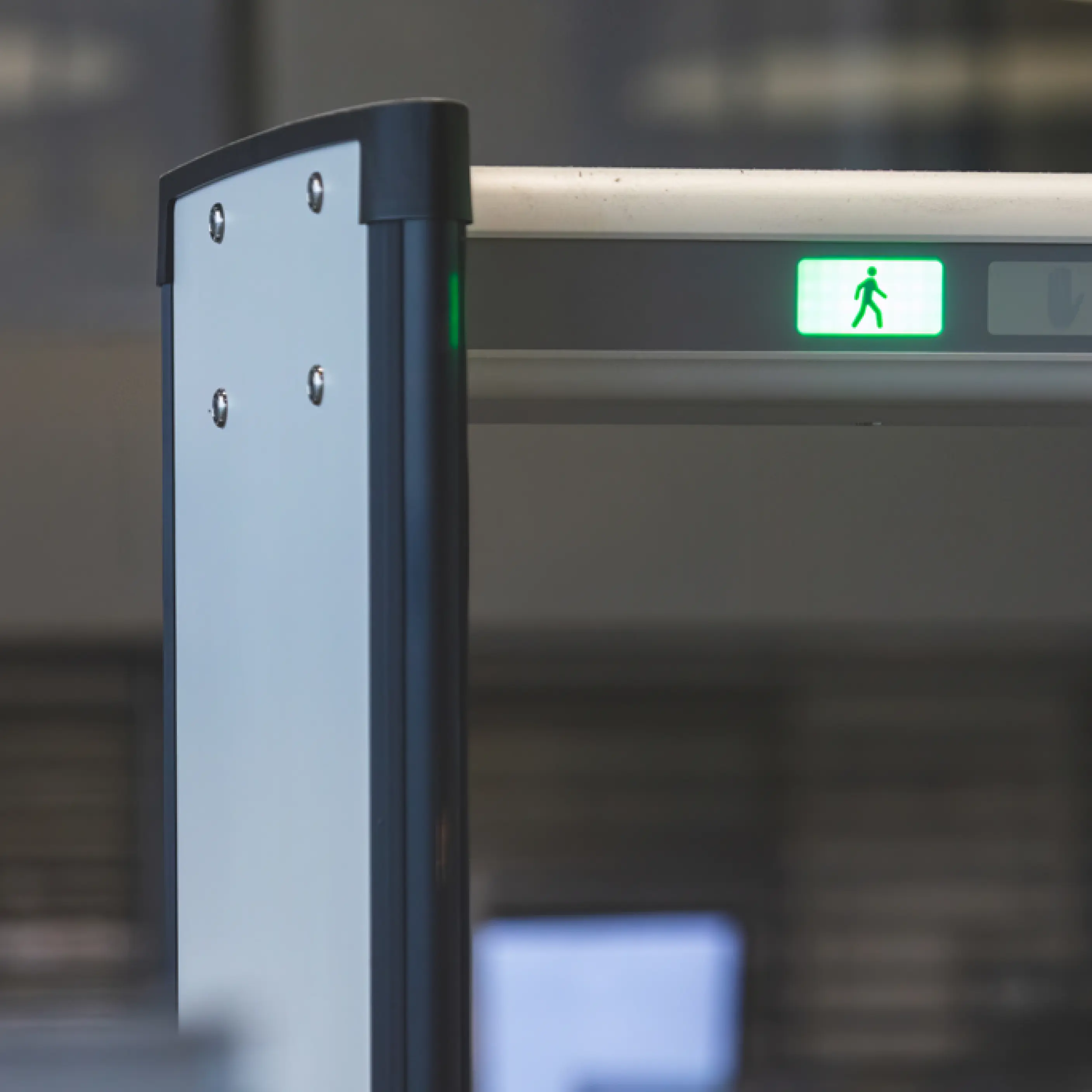 Man standing and operating a Apkudo automated robotic line