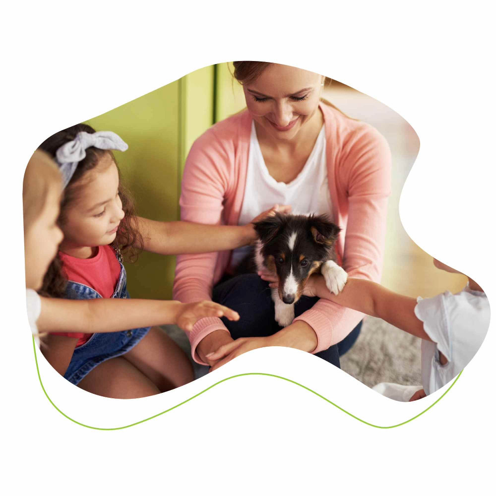 woman and children with puppy.