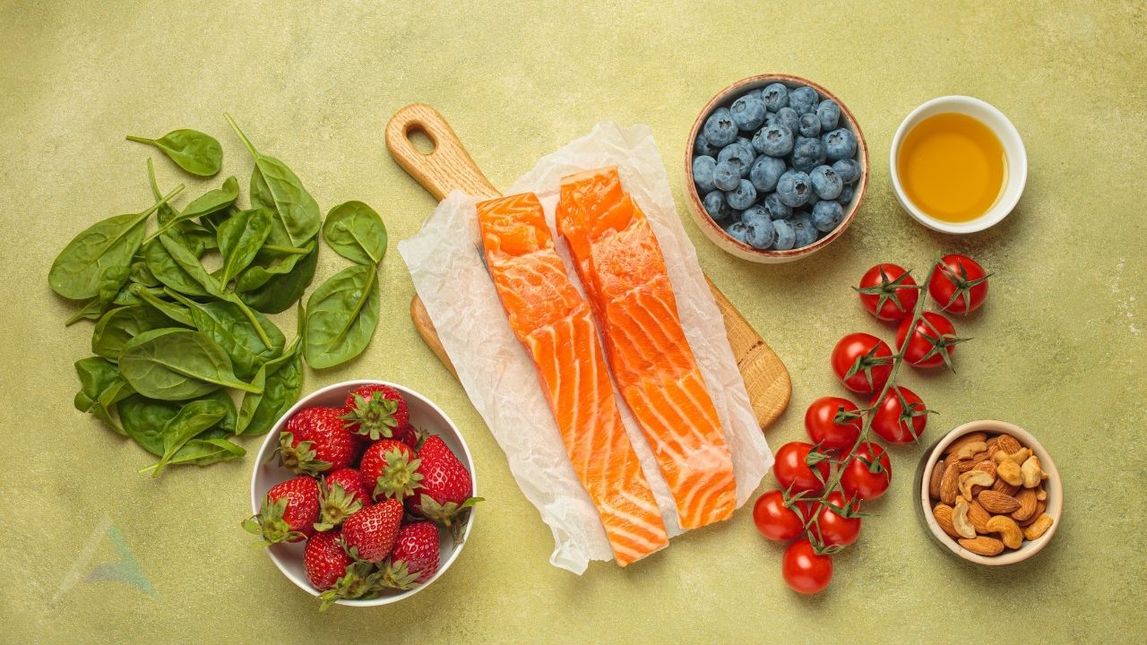 Anti-inflammatory foods including salmon, leafy greens, berries and nuts for nervous system health