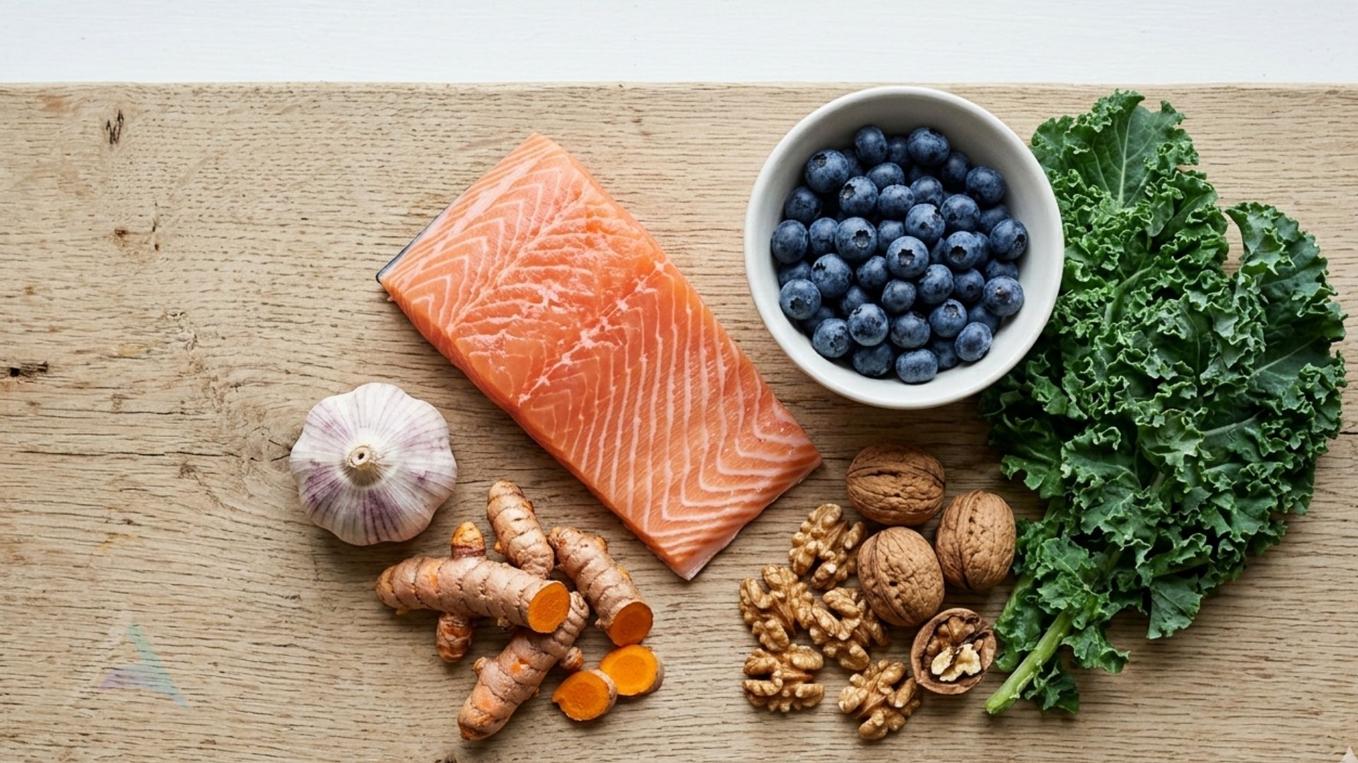 Anti-inflammatory foods including salmon, blueberries, kale, walnuts, turmeric, and garlic representing the best nutrition for nervous system health