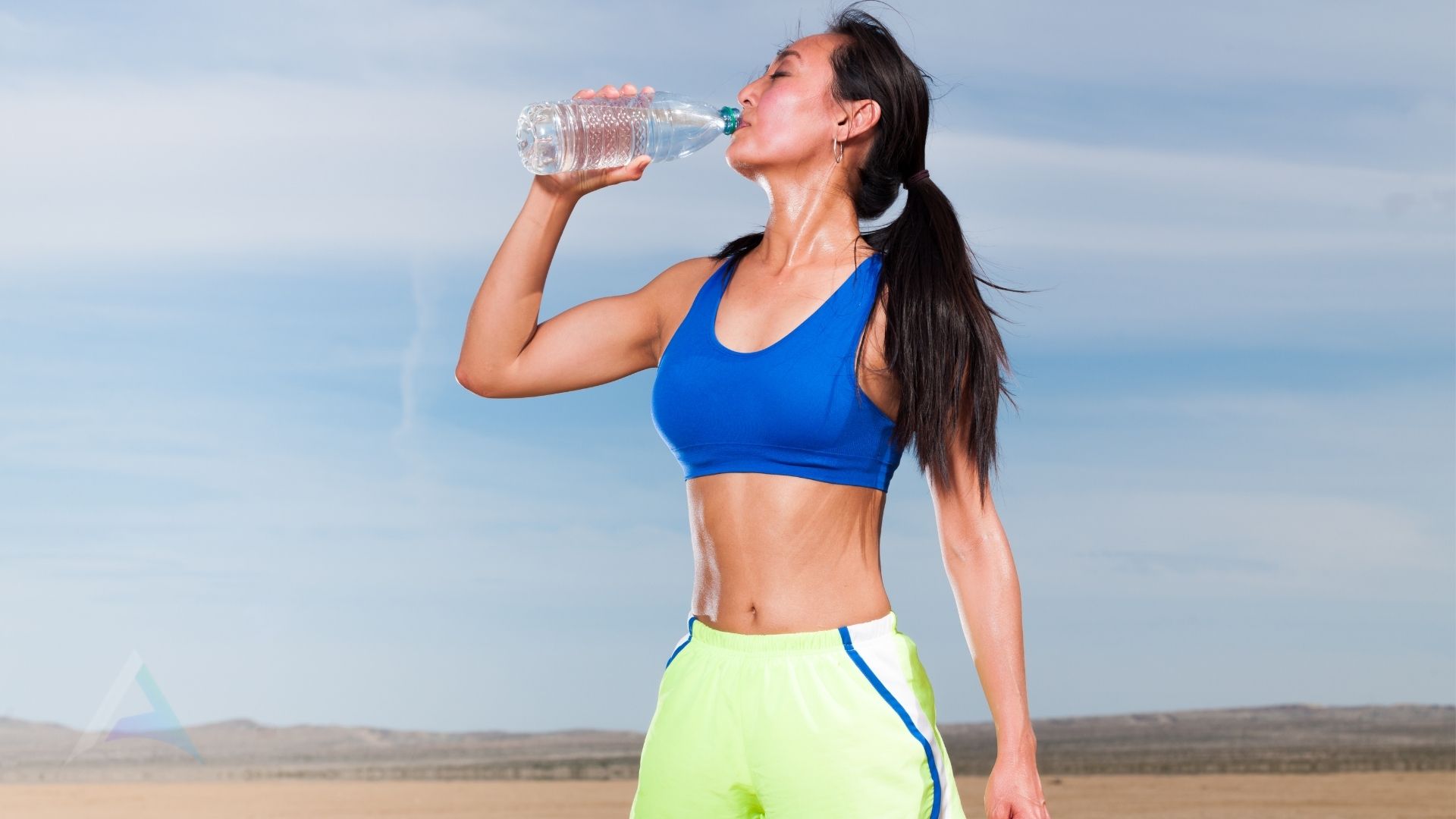 Hand reaching for a glass of water with lemon representing the importance of hydration for nervous system health and preventing dehydration symptoms like headaches and dizziness