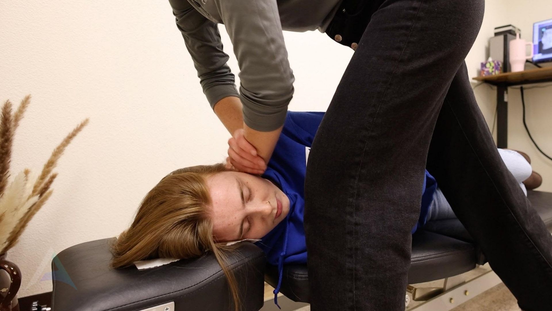 Gentle upper cervical chiropractic contact at the base of the skull, showing the no-twist approach to TMJ relief in Boise