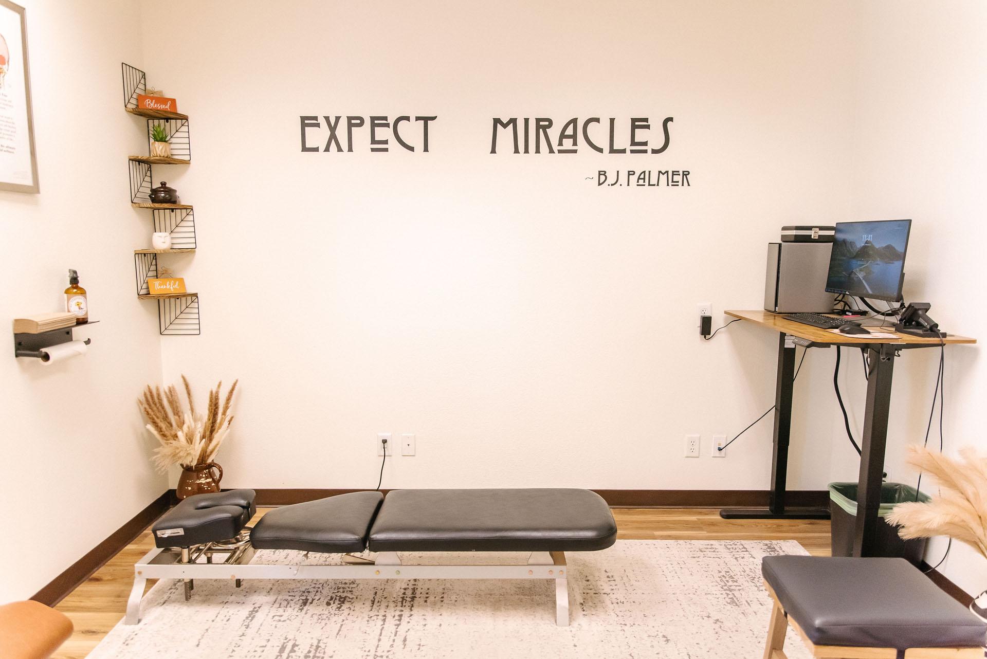 Calm modern upper cervical chiropractic treatment room in Boise with a gentle adjusting table and 3D imaging equipment