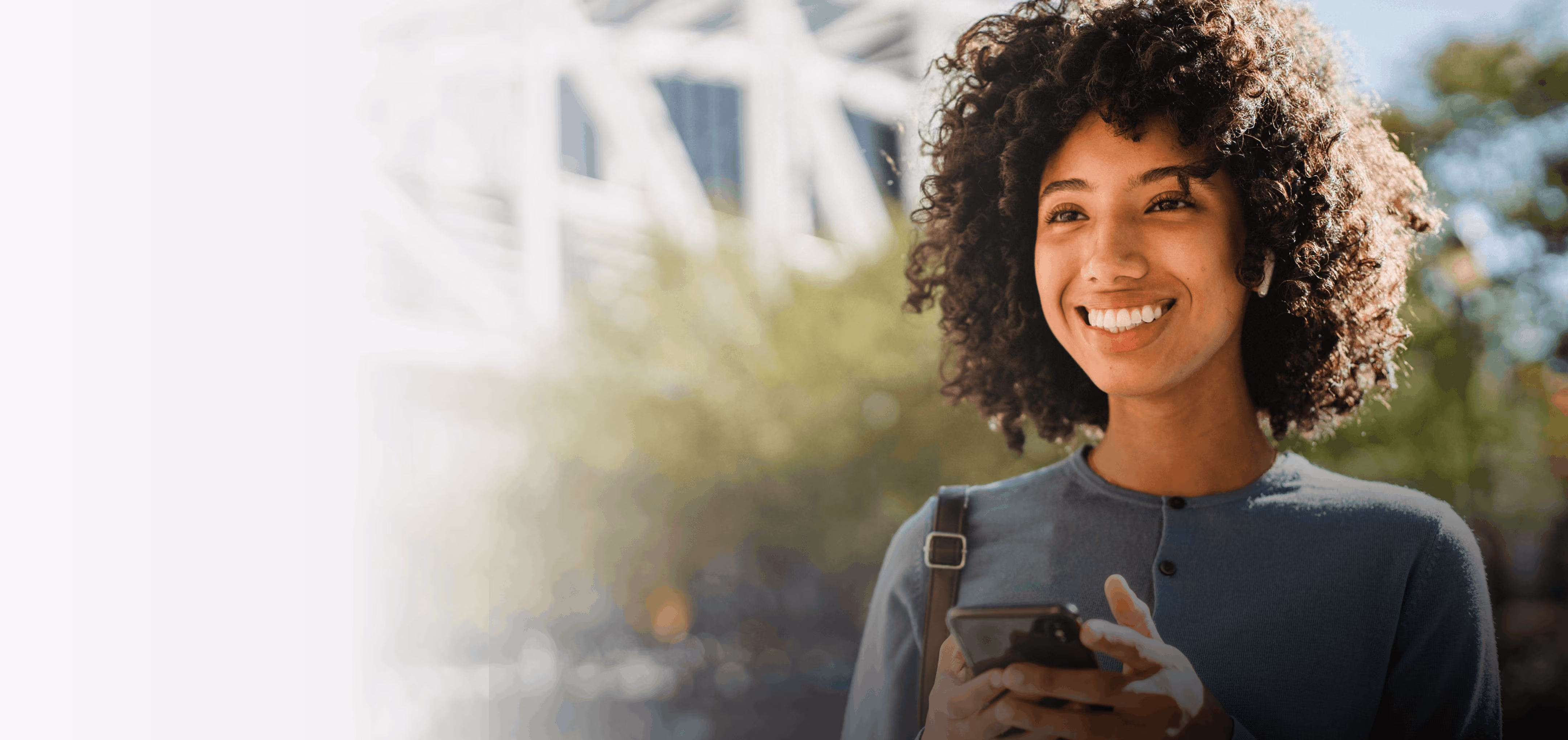 Smiling woman looking at her phone
