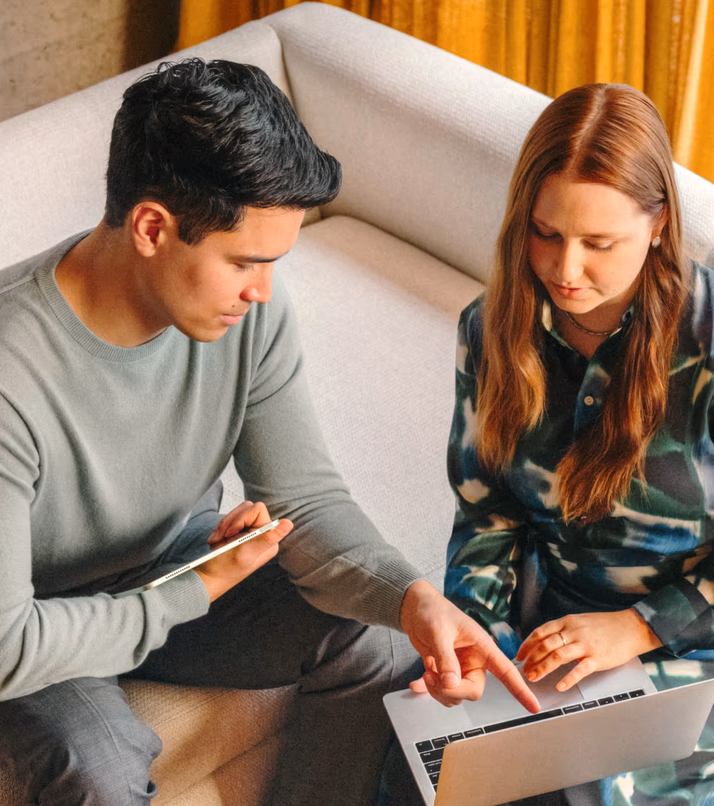 Image of man and woman working on laptop