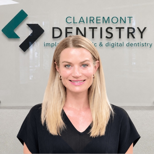 Clairemont Dentistry team member with blonde hair wearing a black top