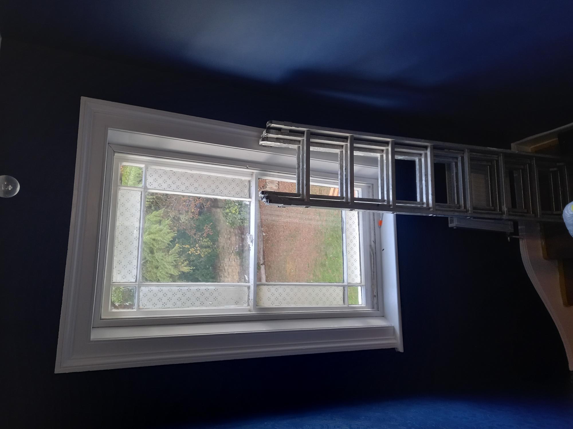 Painted blue wall around window