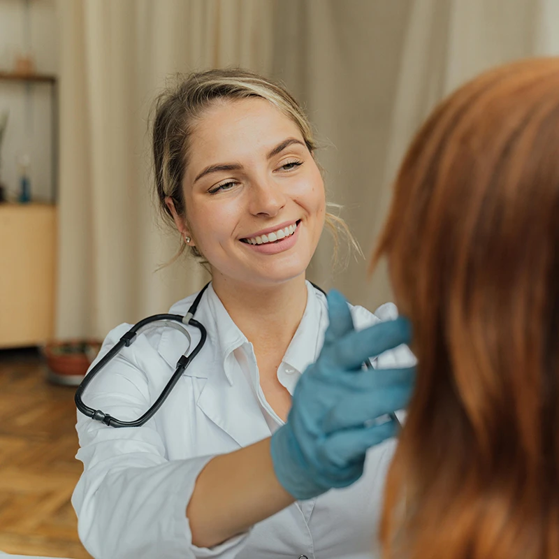 doctor examining patient