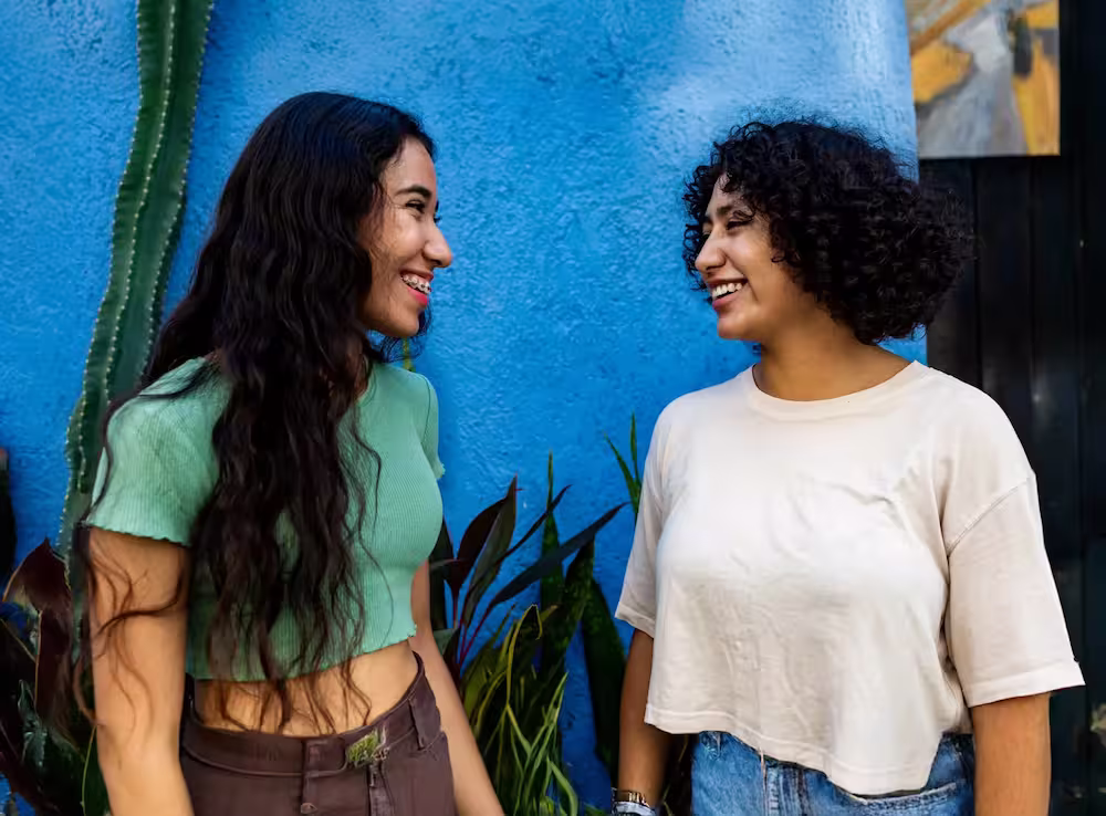a couple of women standing next to each other