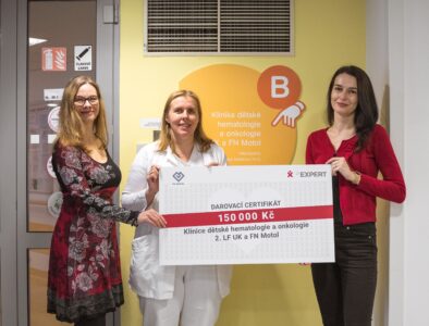 Women holding a gift check