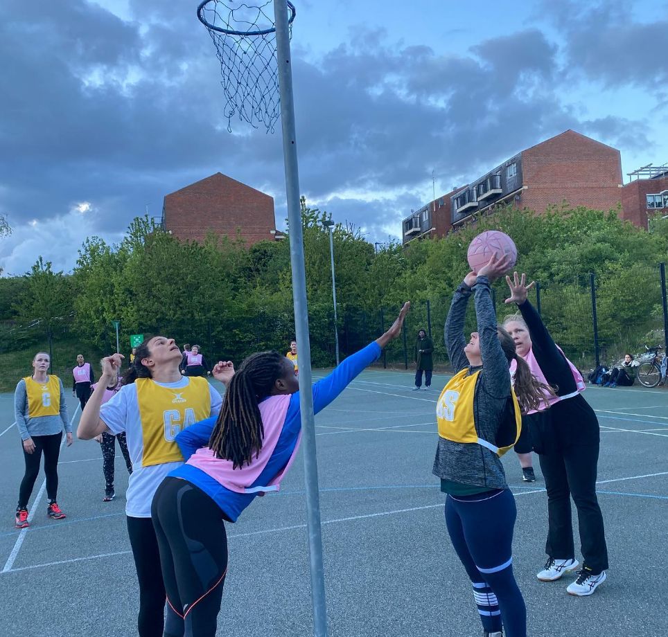 Netball game being played at dusk
