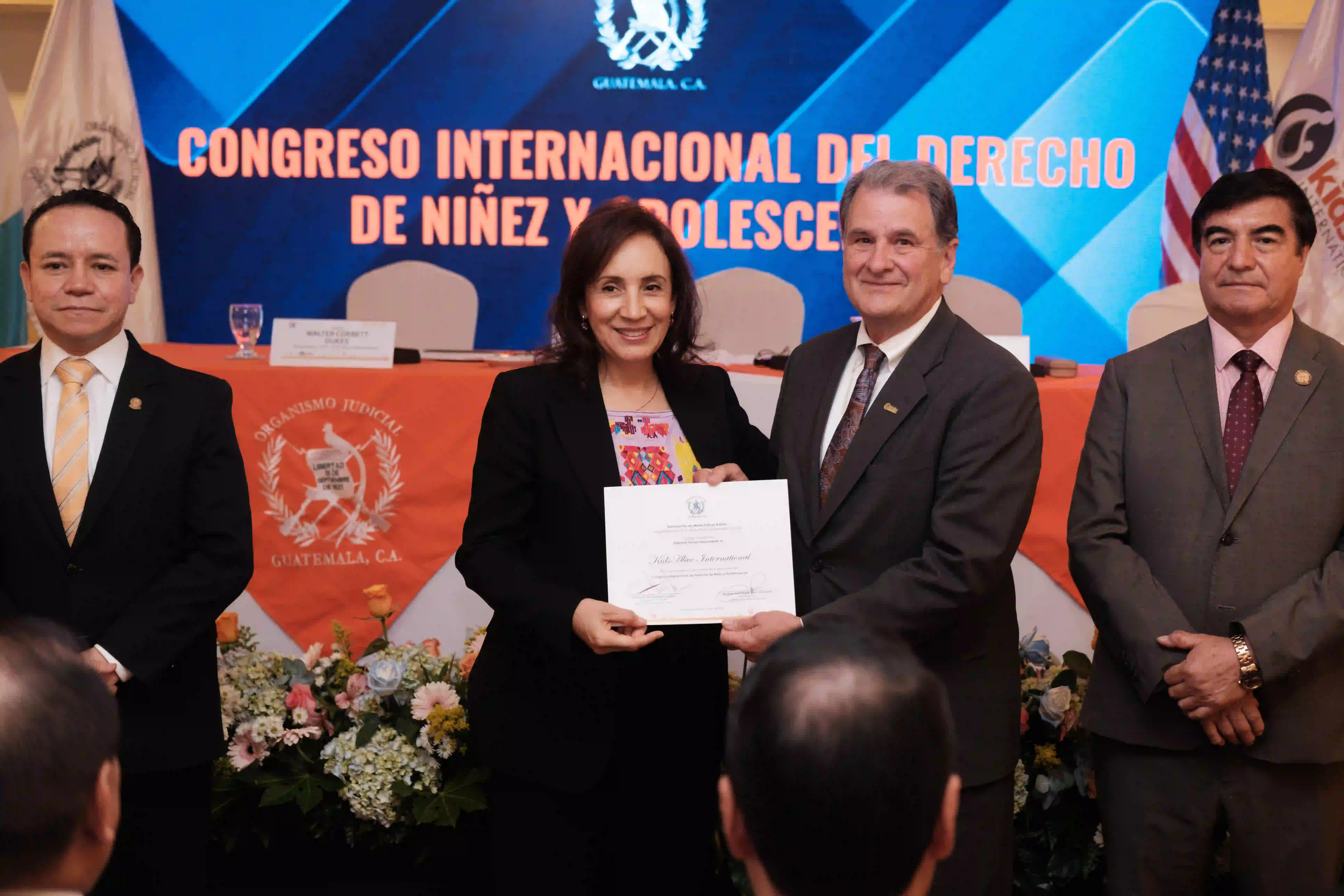 Magistrates of the Supreme Court Of Justice (Left to right): Estuardo Adolfo Cardenas, Flor de María Gálvez Barrios, Corbey Dukes (Kids Alive International CEO), and Teodúlo Ildefonso Cifuentes Maldonado holding a signed agreement