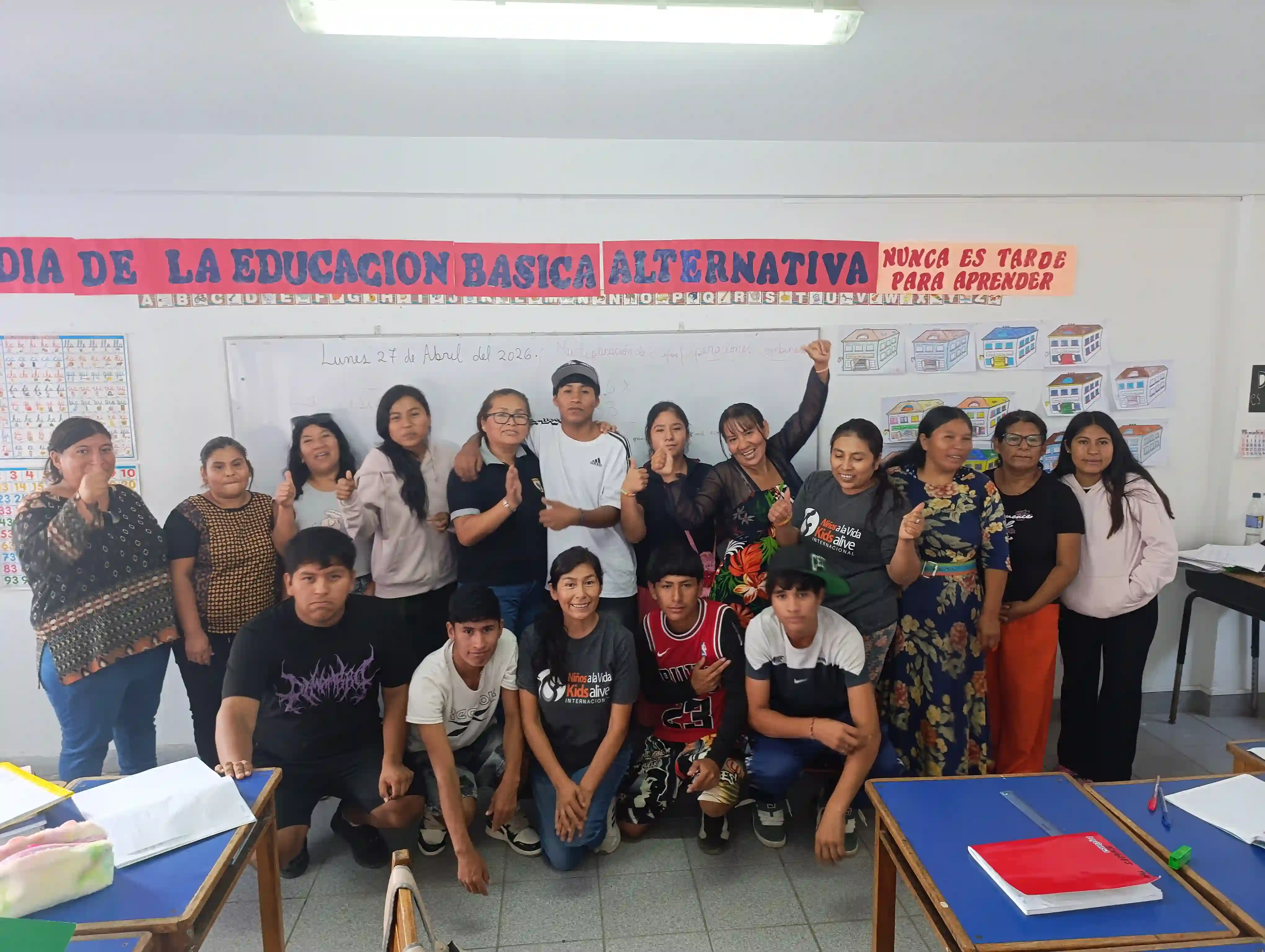 Hugo cheering with his classmates in the Kids Alive Peru restorative education program. 