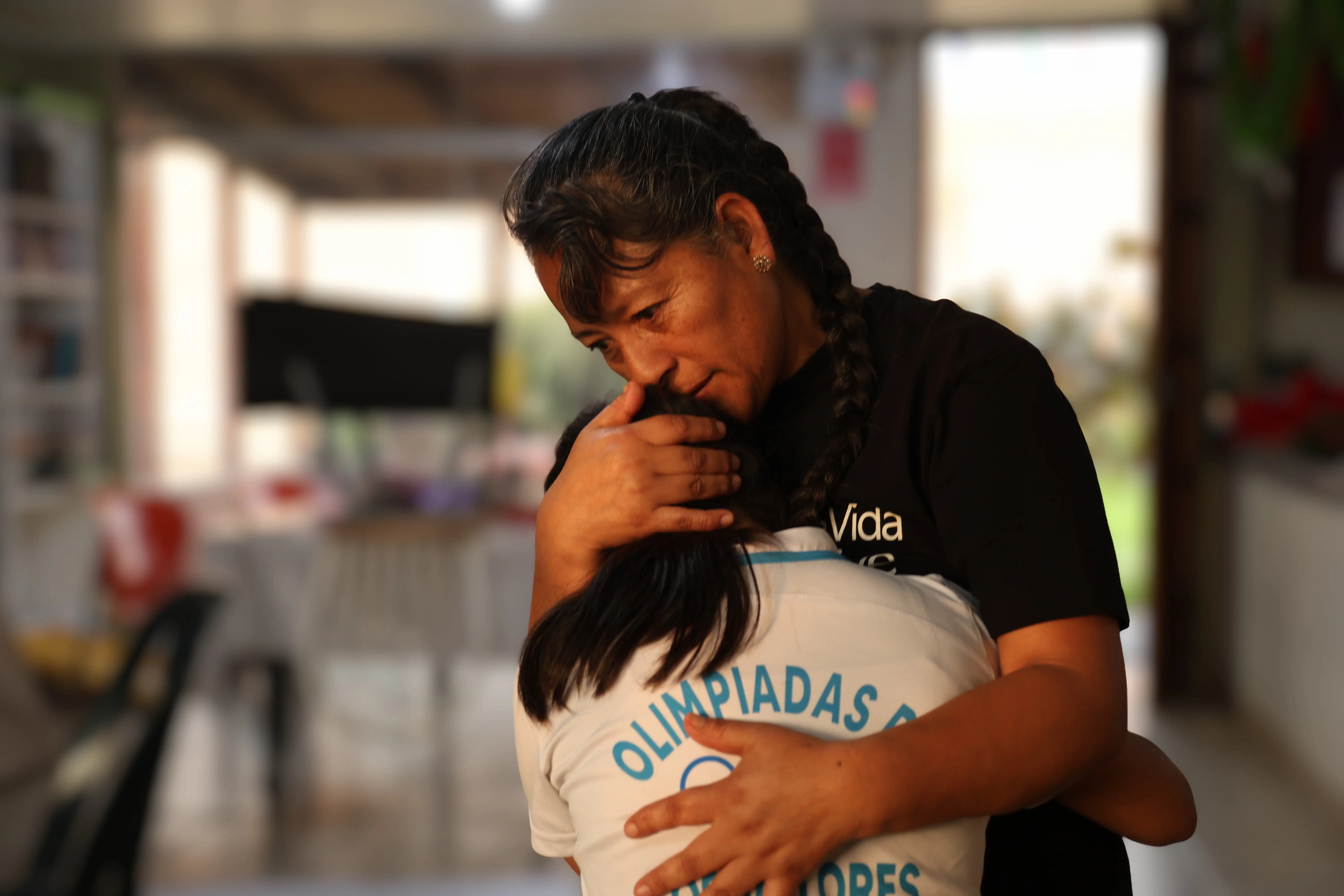 A woman holding a girl