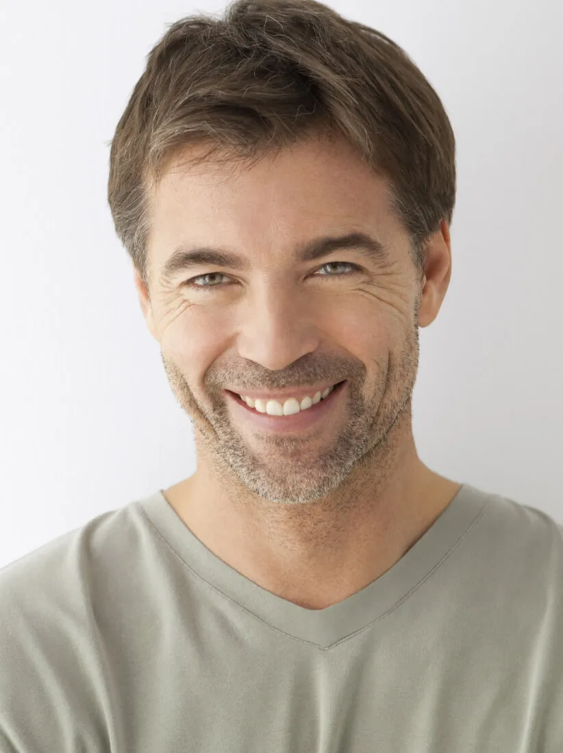 Smiling patient after dental procedure.