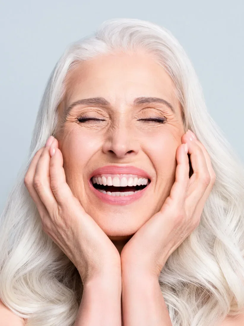 Smiling woman after cosmetic dentistry treatment at a Myrtleford dentist in Australia.