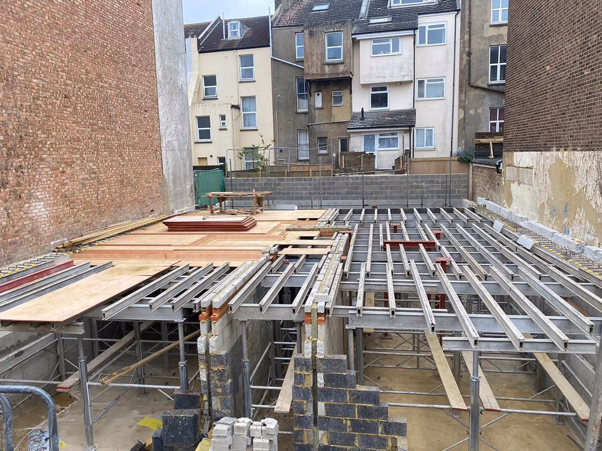 A concrete basement being constructed.