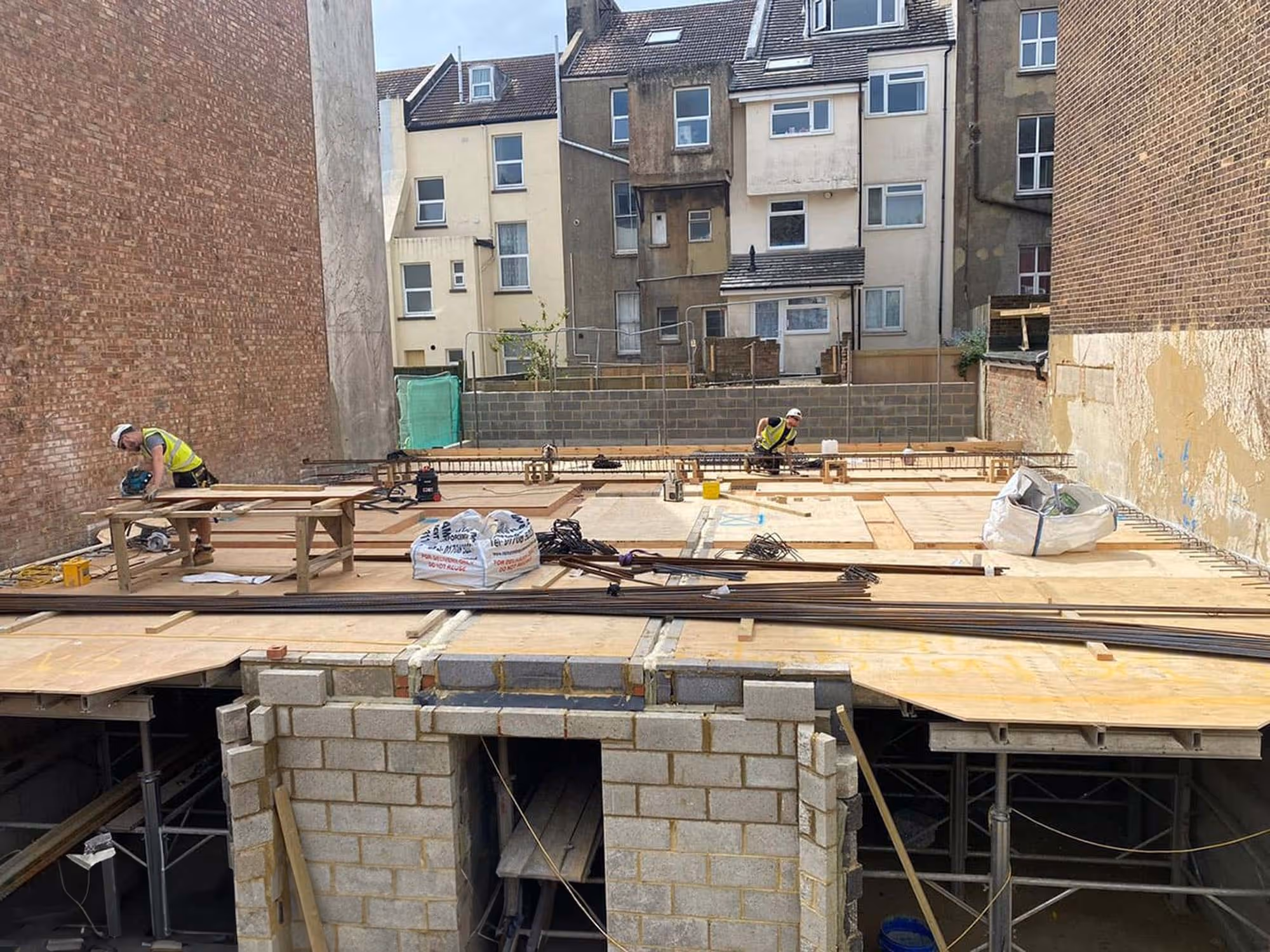 A concrete basement being constructed.
