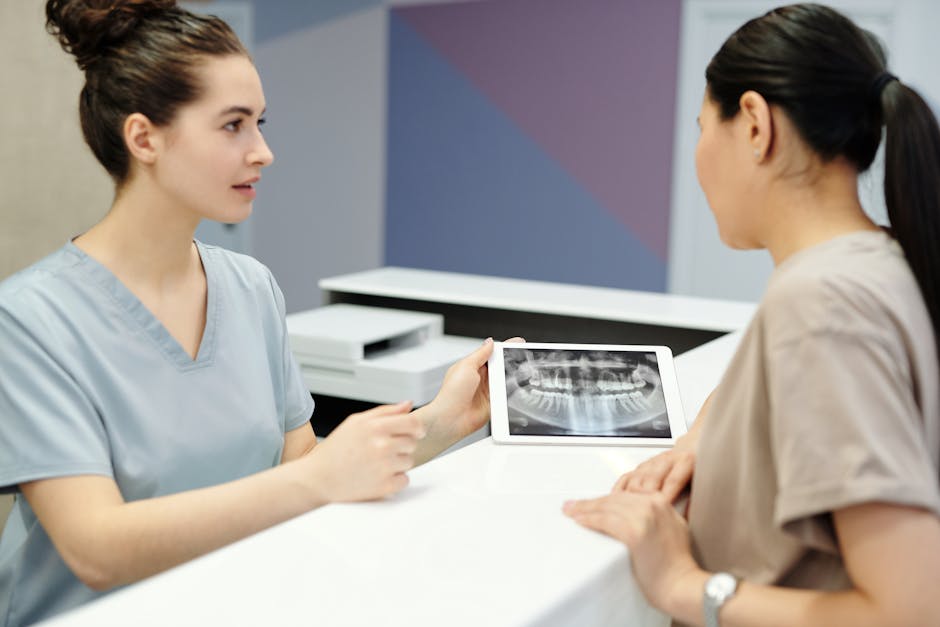 dental implant consultation with dentist and patient - are tooth implants safe