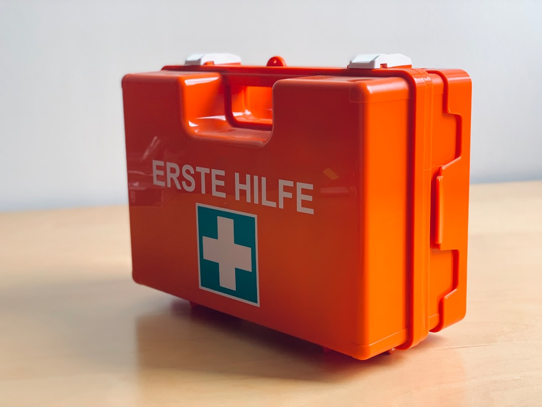 first-aid kit with dental items like gauze and a small container - where to get emergency dental care near me