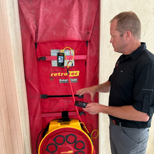 A portable induction stove – black and flat, with no visible coils