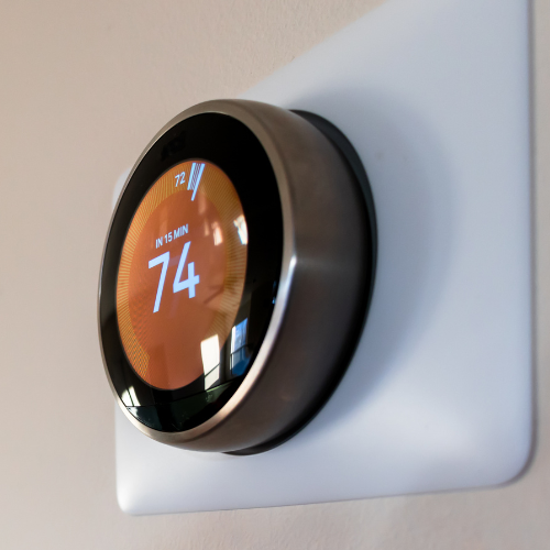 A portable induction stove – black and flat, with no visible coils