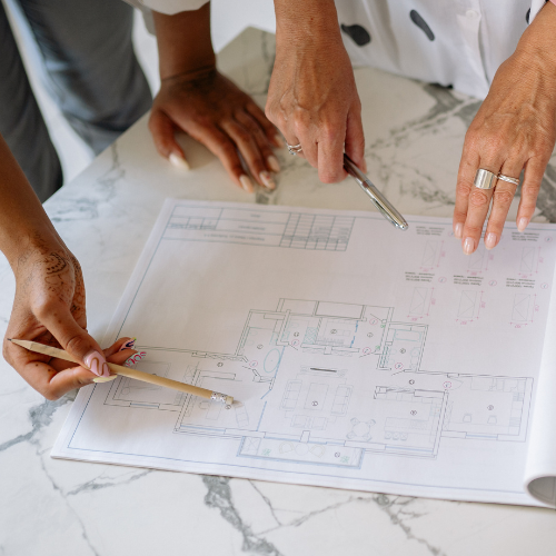 A portable induction stove – black and flat, with no visible coils