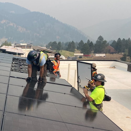 A portable induction stove – black and flat, with no visible coils