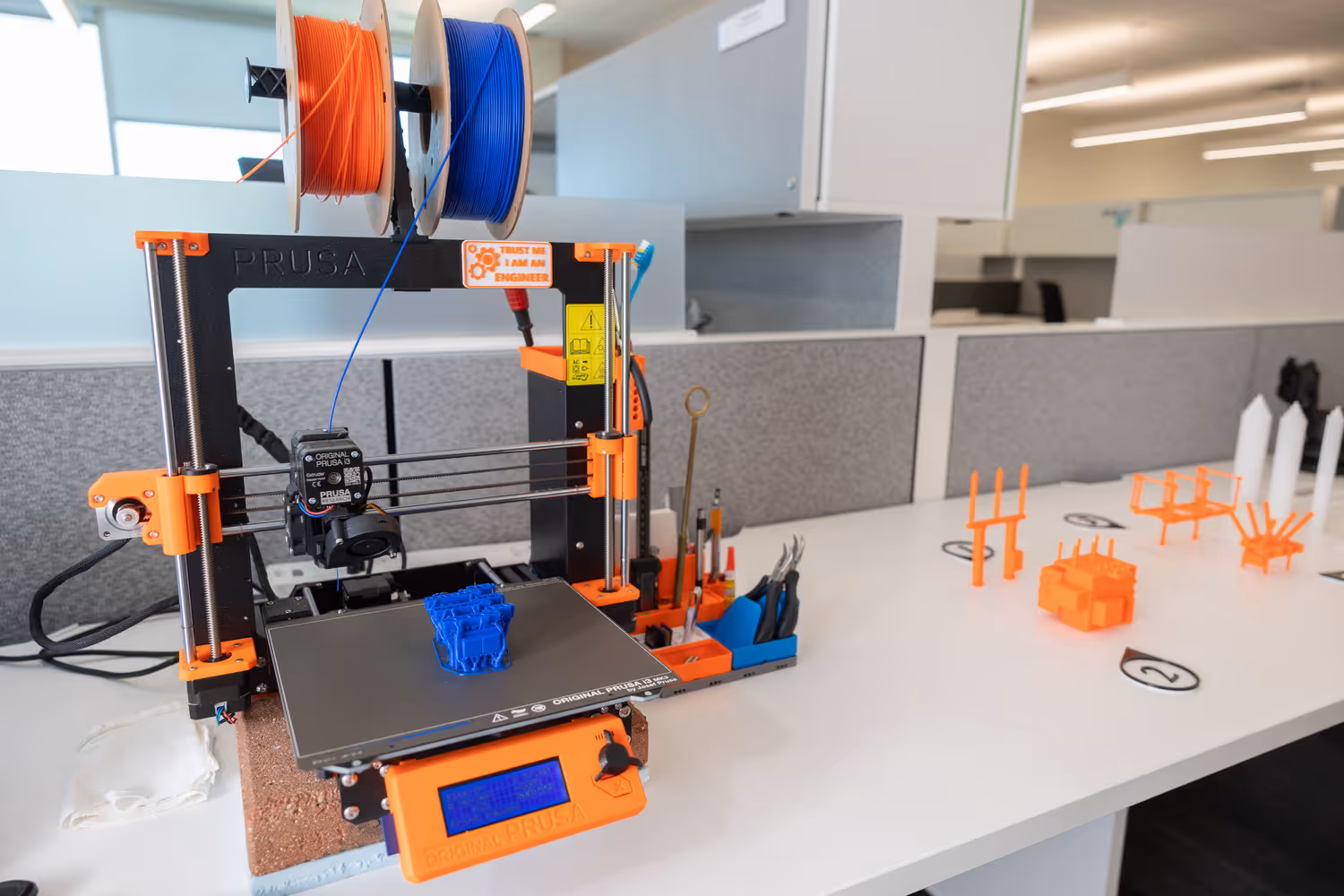 A 3D printer creates scale models of substation components.