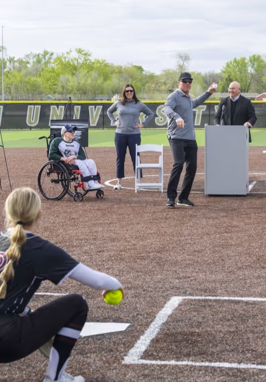 Darin Erstad, a former Major League Baseball All Star and World Series champion, throws out one of the ceremonial first pitches at the Sandhills Global Youth Complex.