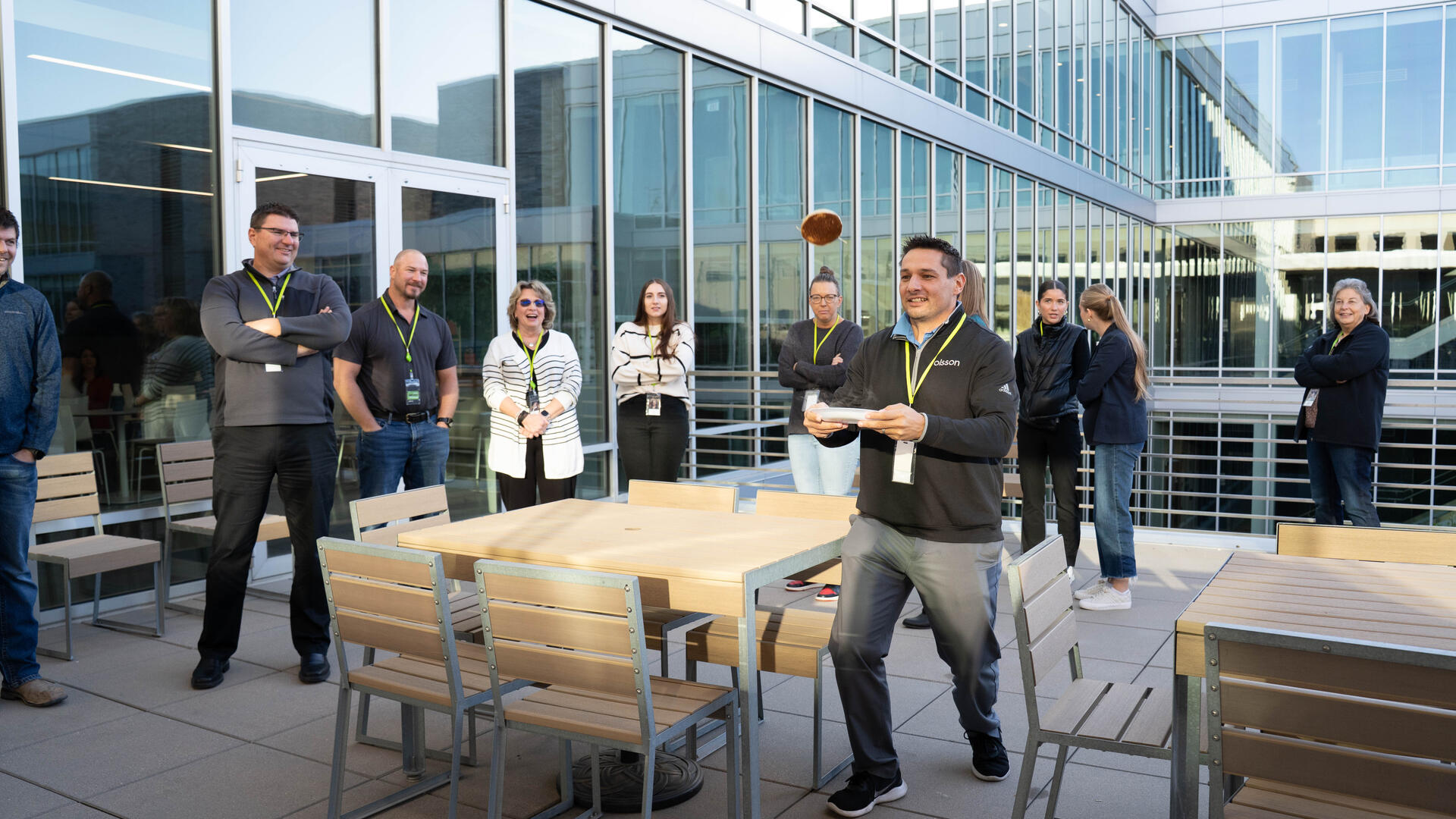 Employees gather for an office-wide breakfast celebration.