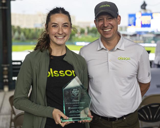 Associate engineer Tessa Lancaster and Nick Steinke, Lincoln's local area leader, accept the award at the ceremony. Credit: Lincoln Journal Star