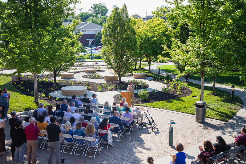Dr. Ali Khan, dean of the UNMC College of Public Health, speaks at the dedication of the school's Indigenous Medicine Garden. The garden features several thousand square feet of Indigenous plants, native grass, benches, and curving pathways.