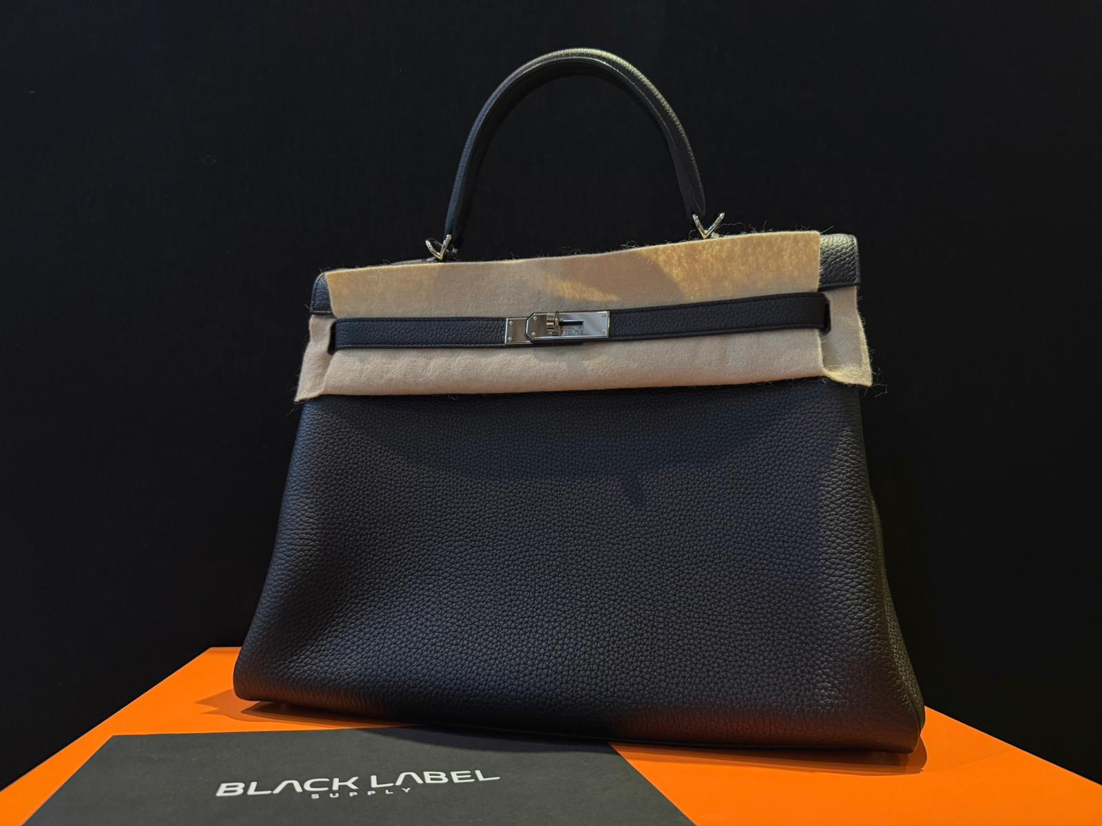 Timeless Sophistication: Hermès Kelly 35 Noir Togo PHW