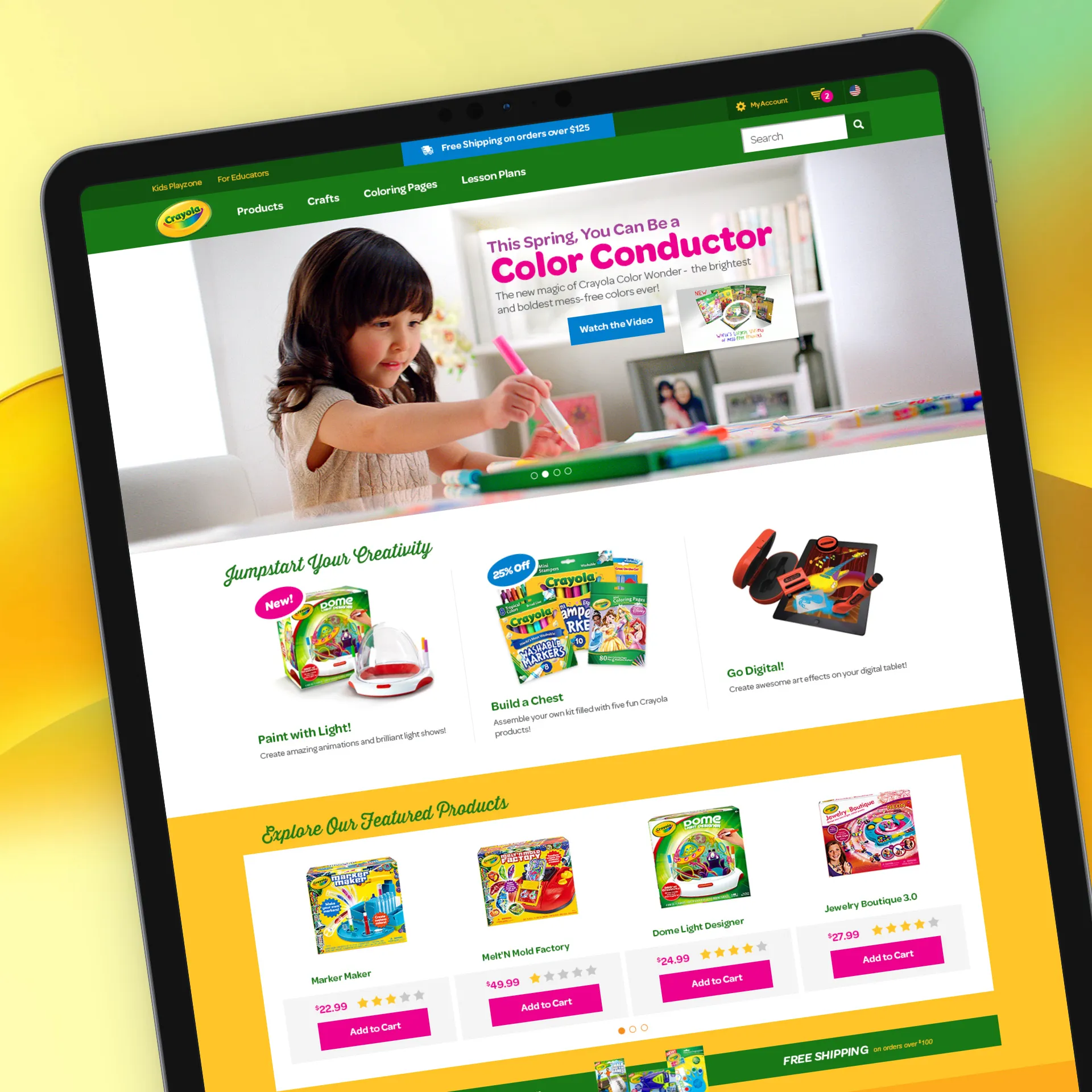 Crayola website on tablet showing a girl coloring and promoting Color Conductor and creative craft products.