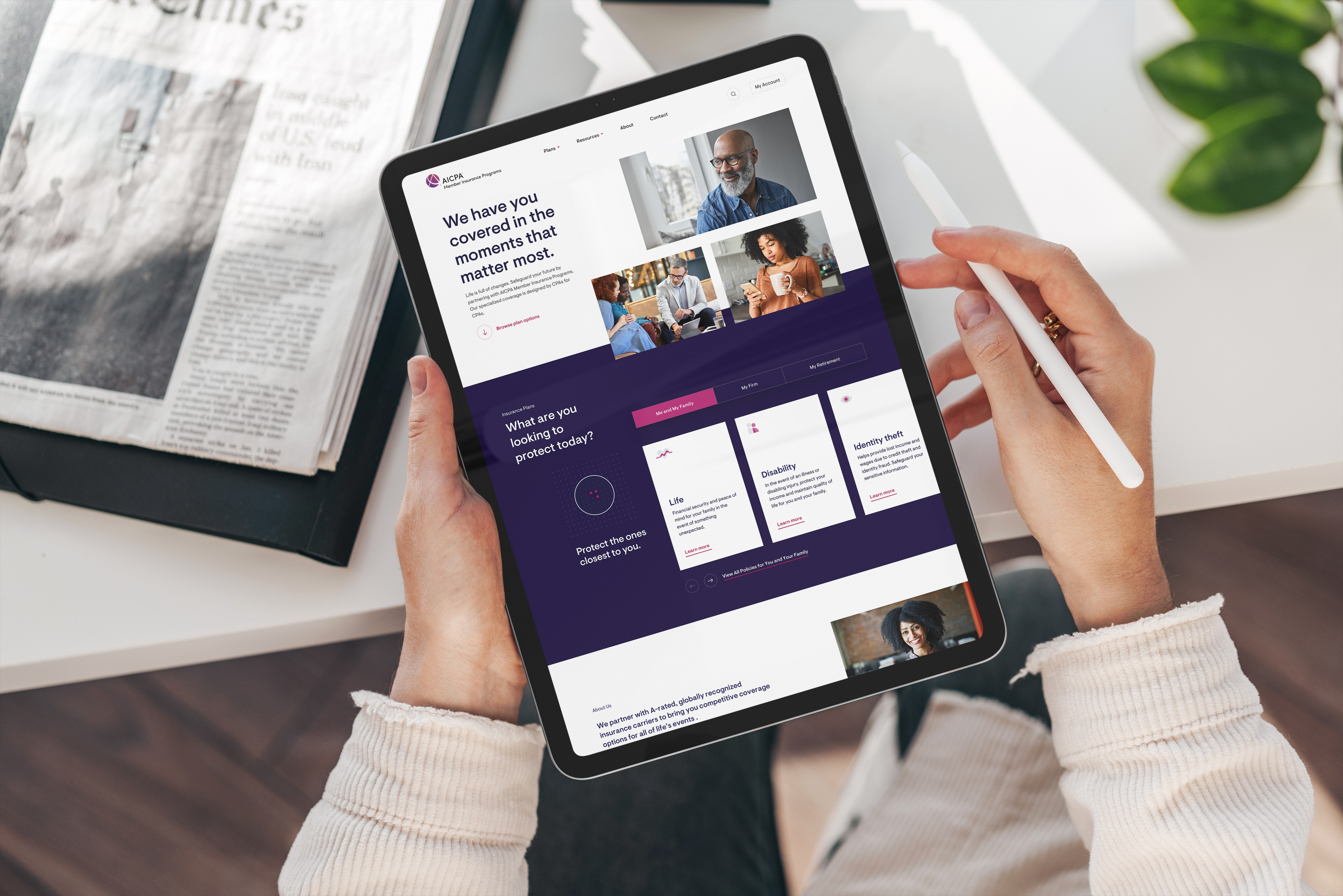 Person holding tablet showing AICPA insurance options webpage with life, disability, and identity theft coverage.