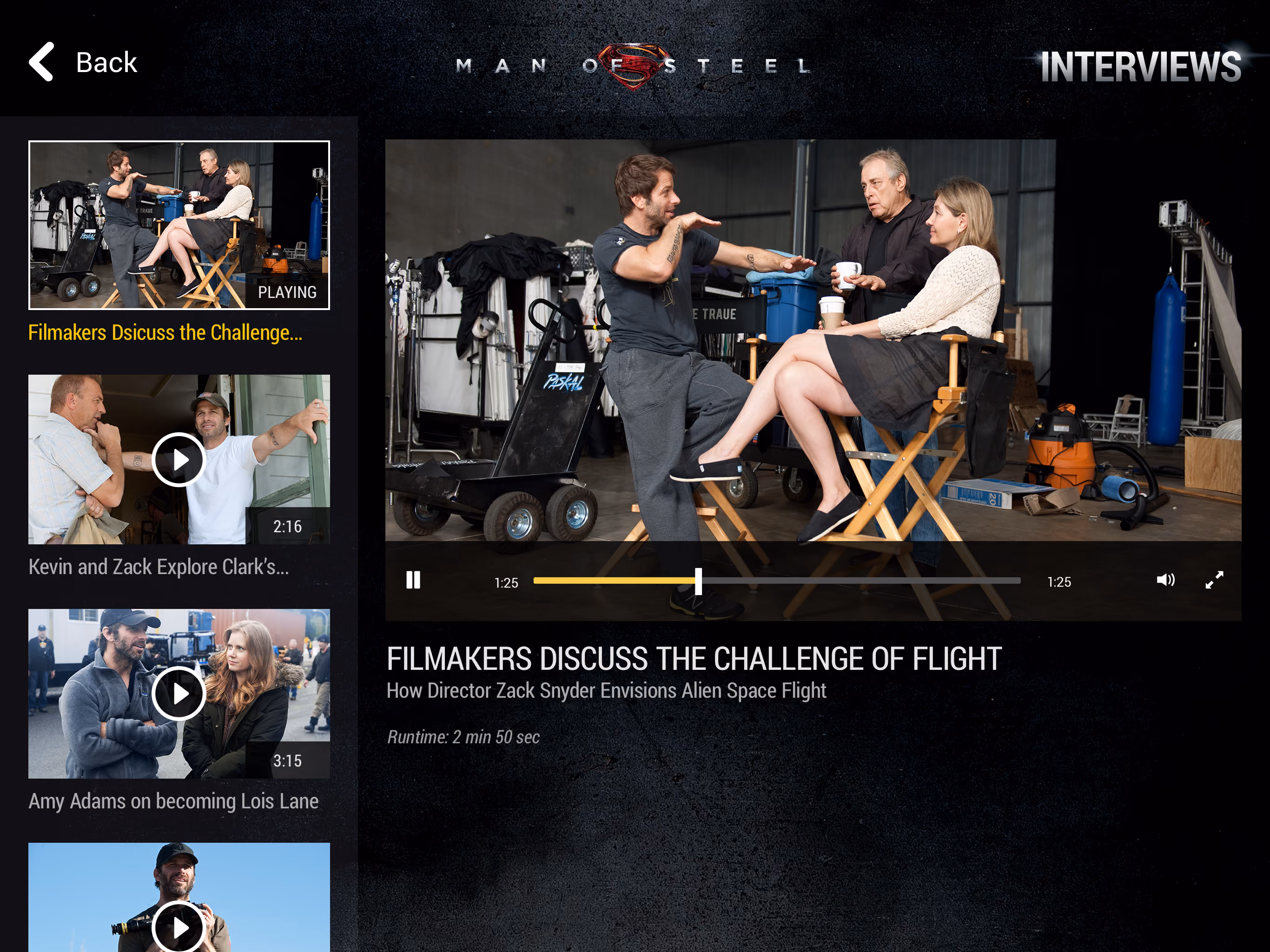 Three filmmakers sitting and standing in a studio discussing the challenge of flight during an interview.