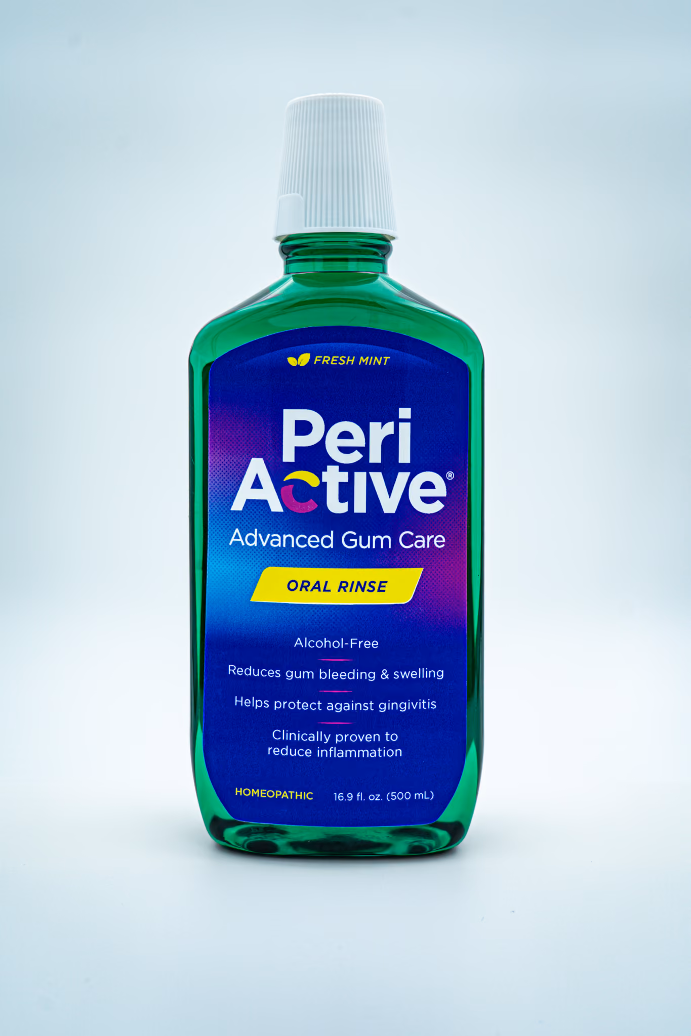 Green bottle of Peri Active Advanced Gum Care oral rinse with fresh mint flavor and homeopathic formula.