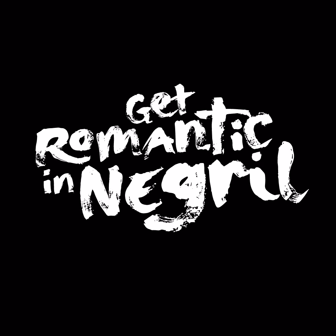 White brushstroke text reading 'Get Romantic in Negril' on a black background.