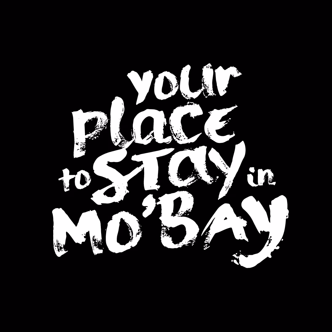 White brushstroke text on black background saying 'your place to stay in Mo'Bay'.