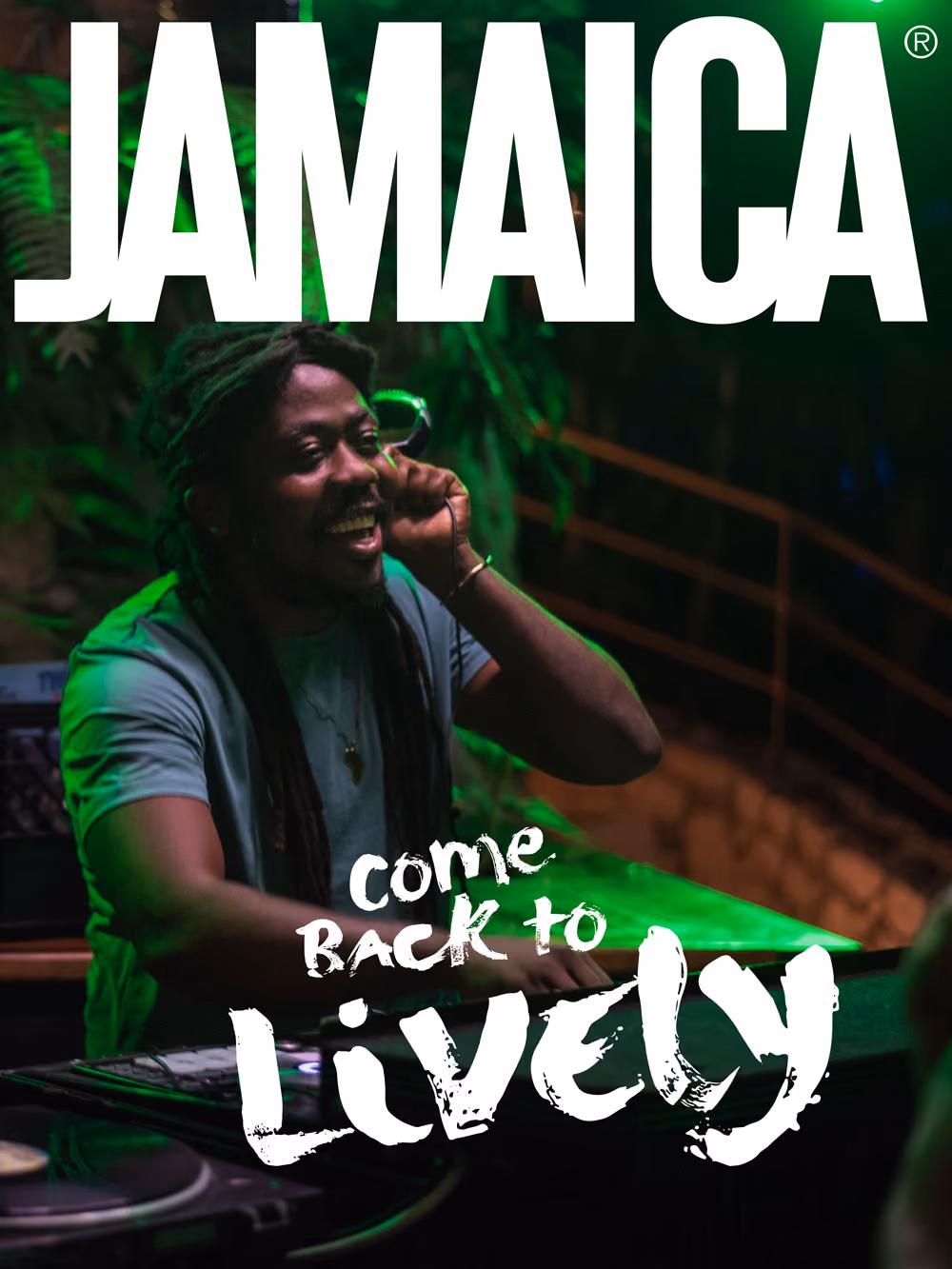 Smiling DJ with dreadlocks performing live at night with green lighting and Jamaica text above.