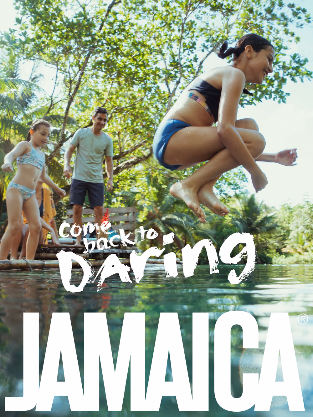Girl jumping into water near family with tropical trees, overlaid text reads Come back to Daring Jamaica.