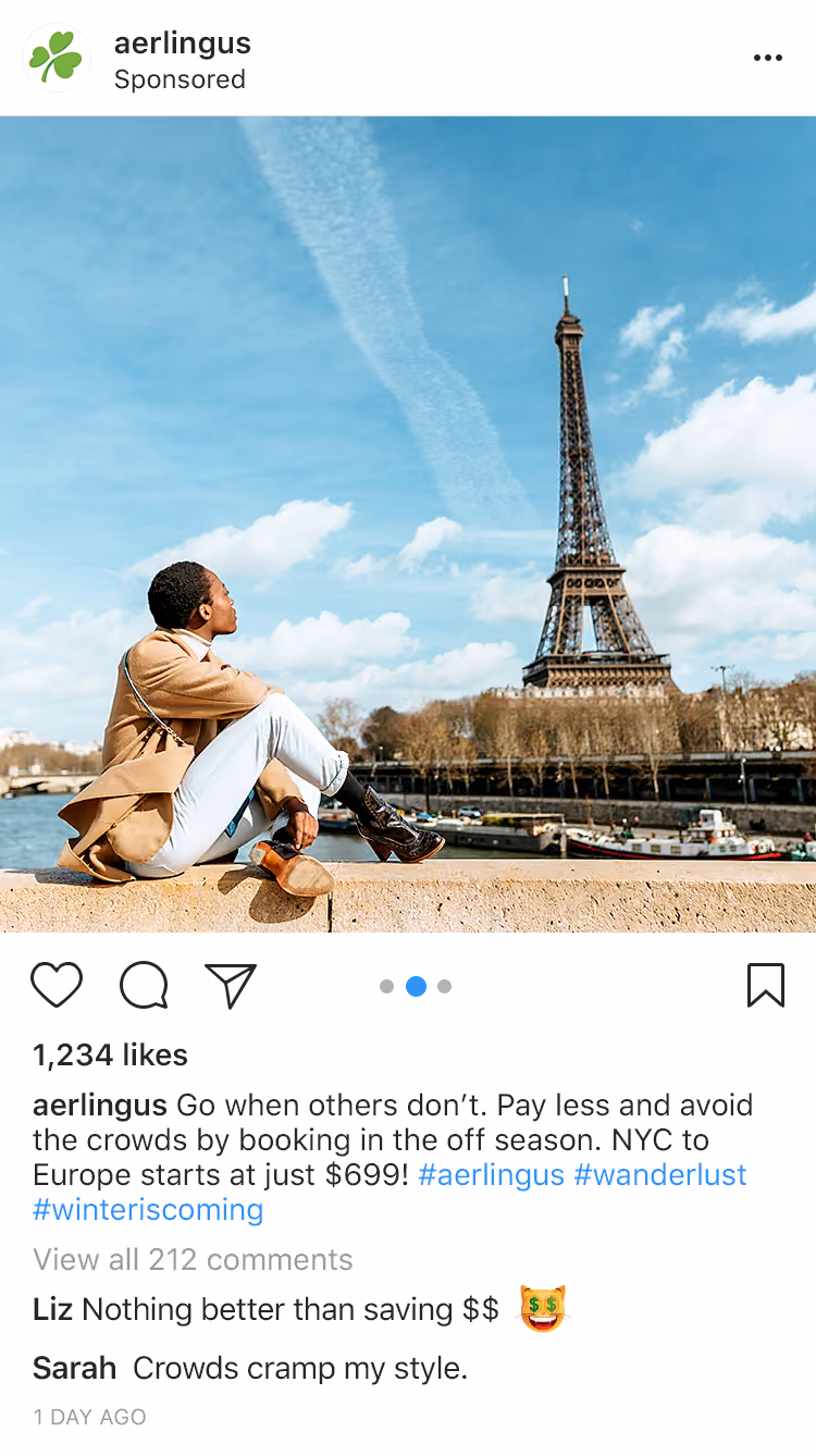 Person sitting on a stone ledge overlooking the Seine River with the Eiffel Tower in Paris in the background.