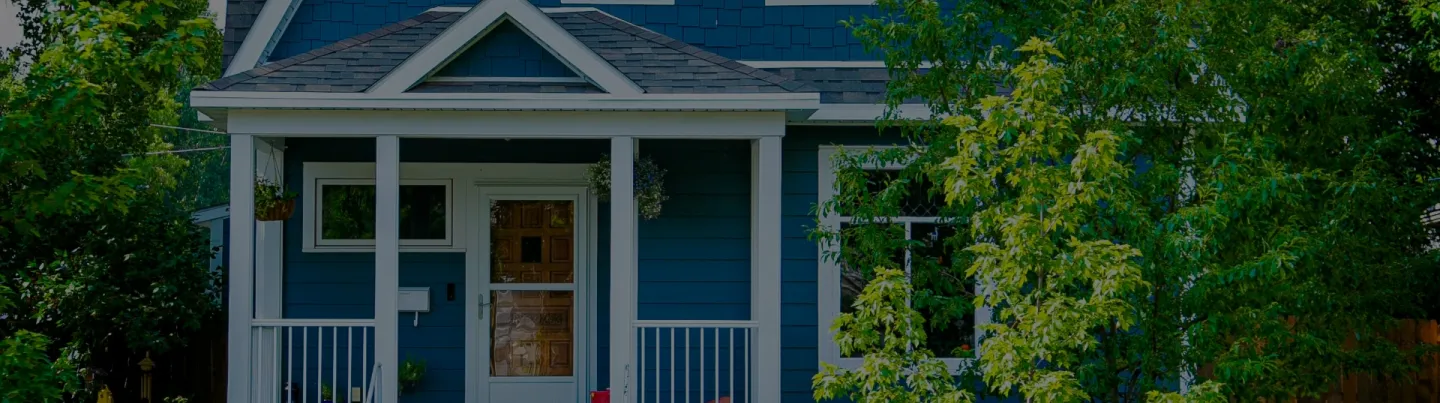 A stunning blue house with modern architecture, perfect for those seeking a stylish and contemporary home in Sarnia-Lambton.