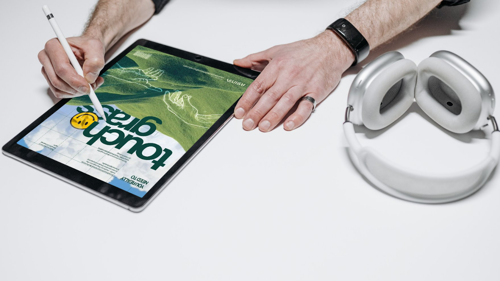 A person designing a poster that says "touch grass" - a gen Z slang term said to someone who's terminally online