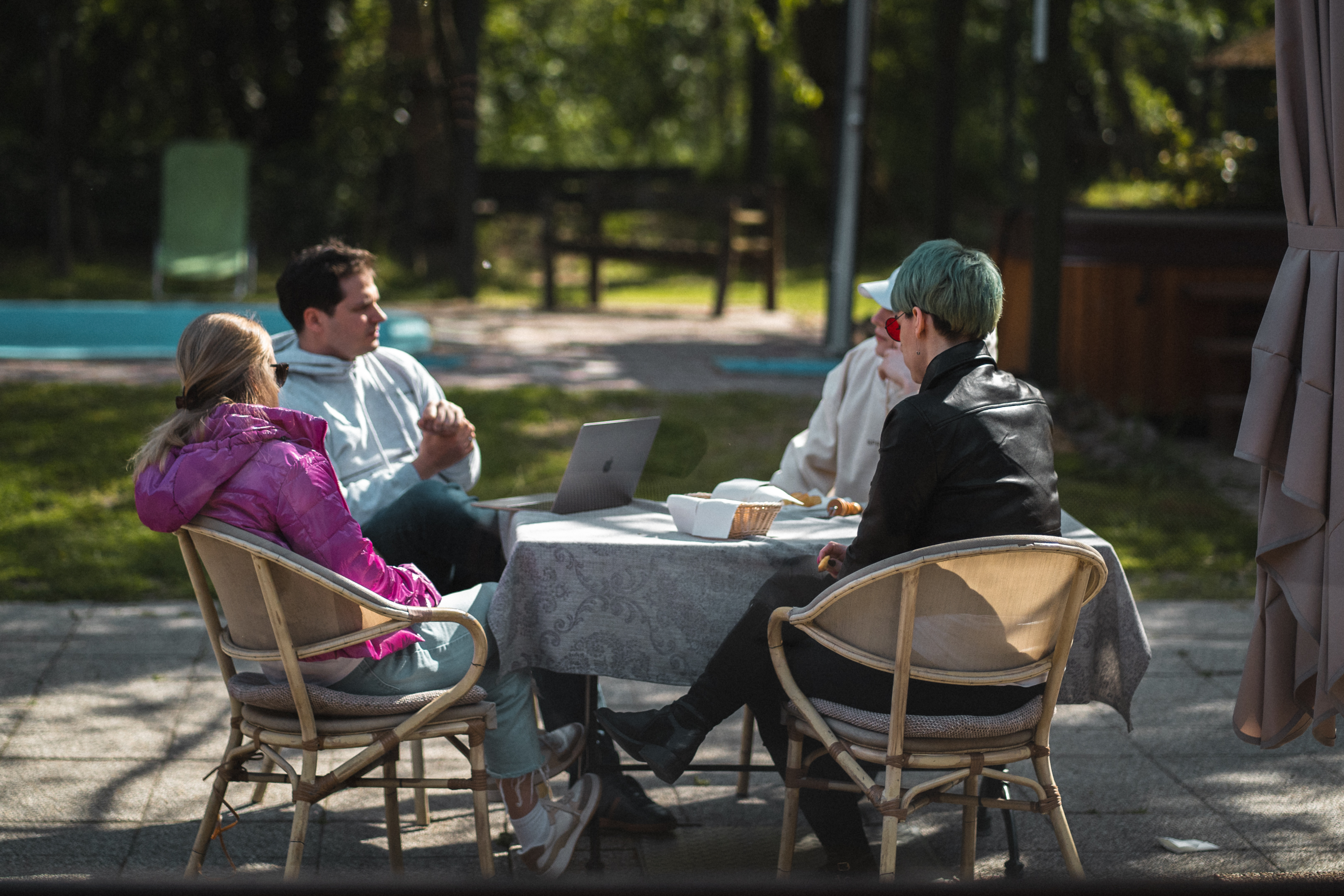 A UX studio product team having an open-air meeting