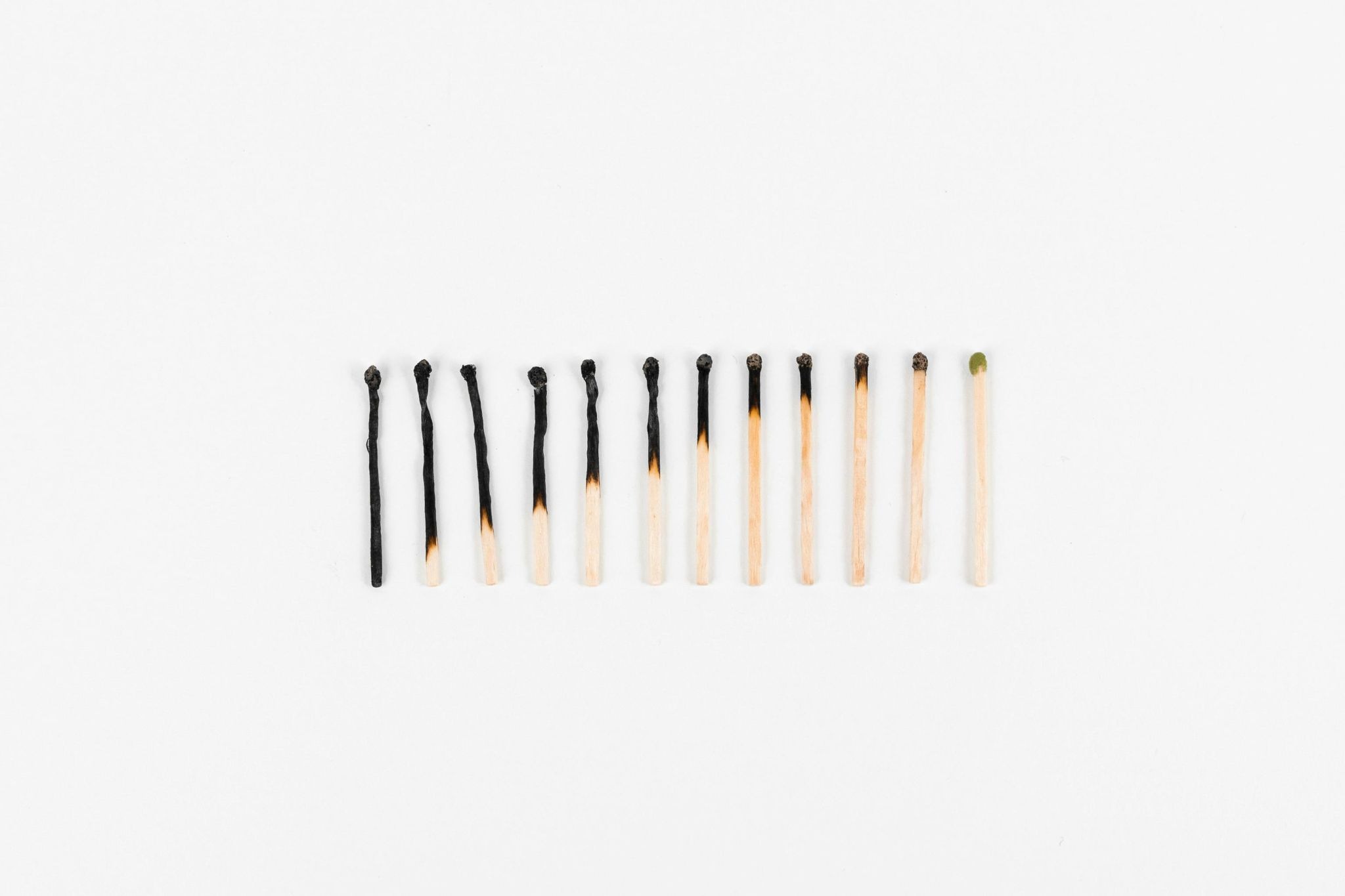 Photo of matches progressively turning to ashes, symbolizing burnout