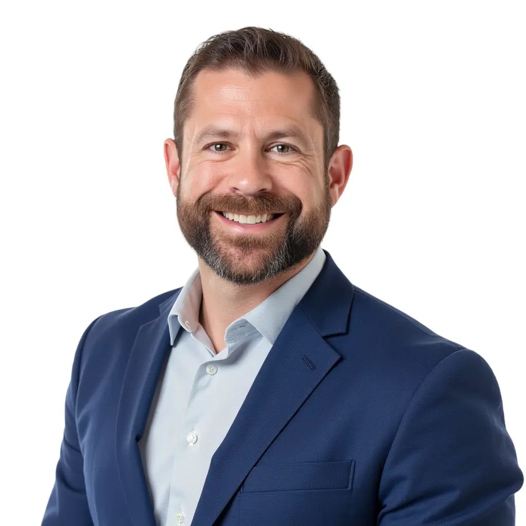 Professional AI headshot of a smiling man in a navy suit jacket and light blue shirt, perfect for company profiles.