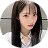 A woman with long black hair and a white shirt.